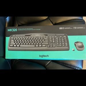 New MK320 Logitech wireless keyboard mouse combo with media shortcuts.